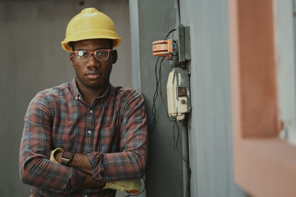 Experienced construction professional wearing a hard hat and safety glasses